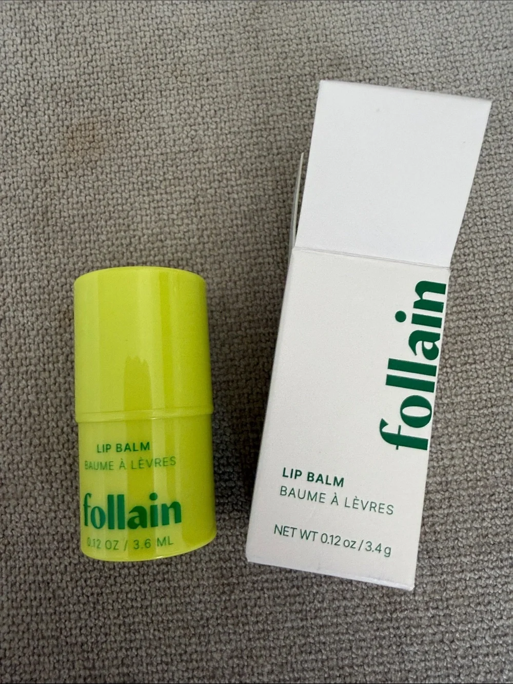 REVOLVE Follain Lip Balm in Neon Yellow-Green